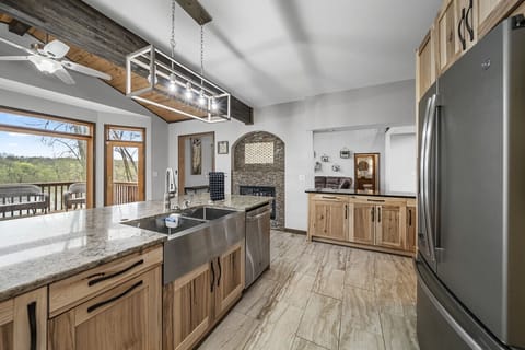 You will love the high-end appliances & easy flow of the gourmet kitchen.