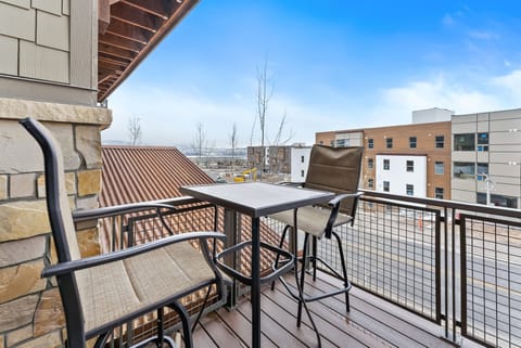 - Enjoy scenic balcony views with a high top table and chairs  
- Sip morning coffee or evening drinks with mountain surroundings  
- Private outdoor seating adds charm to your vacation rental