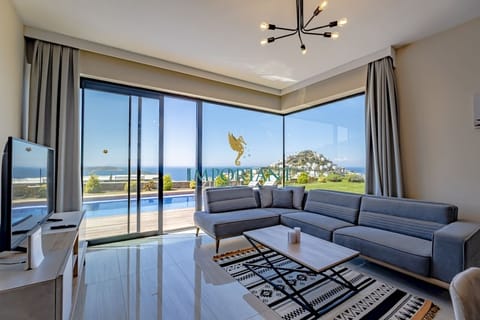 Deluxe Villa, Private Pool, Sea View | Living room | 40-inch Smart TV with cable channels, TV