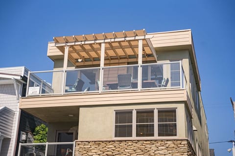 Ocean Mist I is the top (3rd) floor and left side of bottom floor, garage and patio.