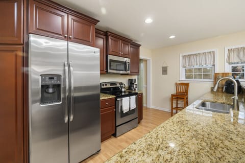 Warm Wood Cabinets and Stainless Appliances.
