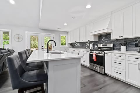 Large kitchen with island seating for family meals.