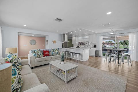 Living room with sleeper sofa.  Open layout into the kitchen 