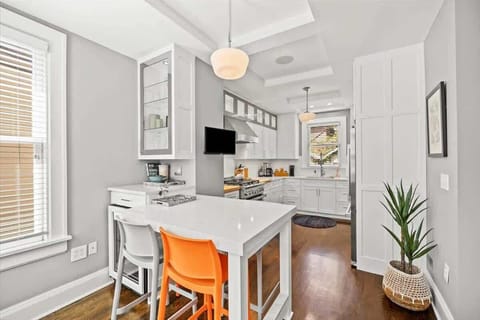 The kitchen island is perfect for kids or friends to hang out while you prepare your favorite foods.