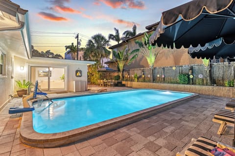 As the sun sets, the pool comes alive with soft lighting, offering a magical backdrop for an evening swim or cocktail.