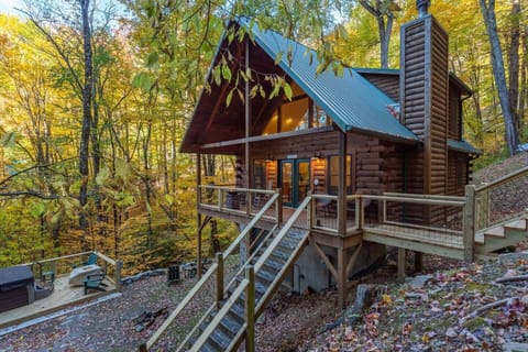 Outside of cabin large deck and hot tub.