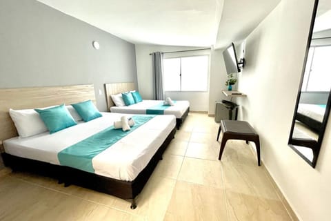 Deluxe Quadruple Room | Premium bedding, down comforters, Select Comfort beds, desk