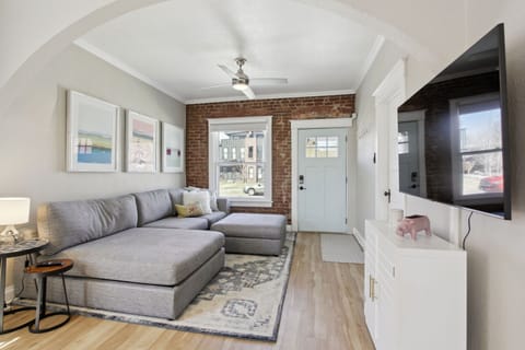 Living room with West Elm couch, 55'  inch smart TV and new LVP flooring