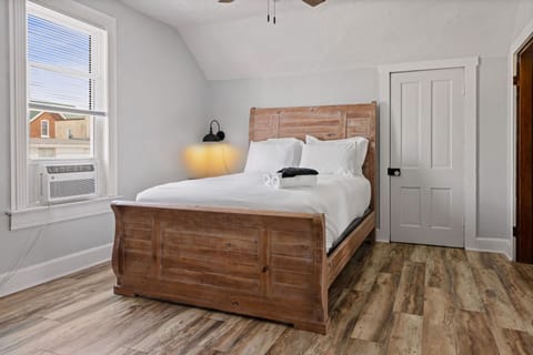 The second bedroom upstairs features a comfy queen size bed with 4 pillows