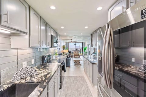 Whip up island-inspired meals in this sleek, ocean-view kitchen—fully stocked, Insta-worthy, and steps from the living room and lanai. 🌺🍳🌊