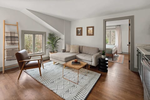 Open Concept Living Room | XL Flat Screen TV | Hardwood Floors | Third Floor
