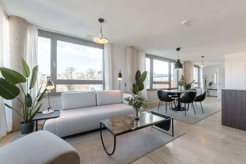 Spacious living and dining area with modern decor, perfect for entertaining.