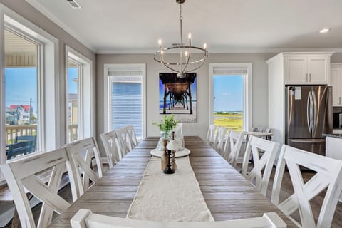 Beautiful dining room table with seating for 12 to all gather around