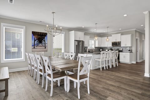 Open floor plan with plenty of seating room for everyone to gather with 12 at the table and 4 more at the kitchen island