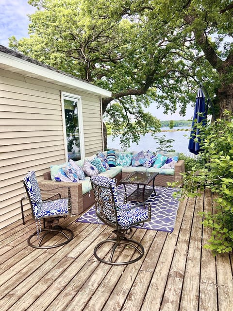 outdoor lounge seating overlooking the lake and yard for morning coffee or HH