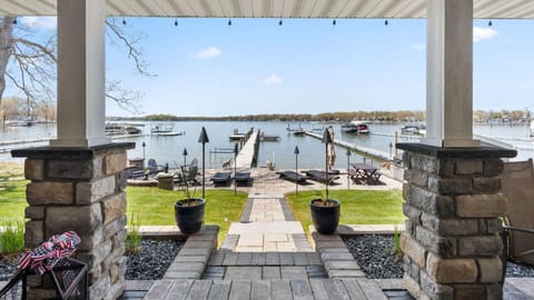Covered porch with stunning lake and dock views