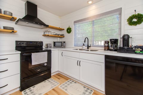 Updated kitchen with open shelves makes finding everyday dishes a breeze!