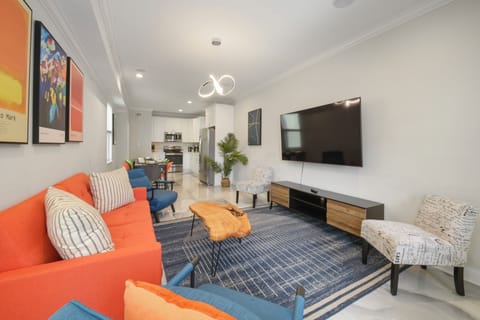 Living- enormous sofa, 70 inch smart tv, designed for comfort and additional bed