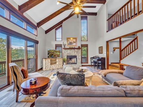  Enjoy bright and cozy decor in your living room with panoramic mountain views.