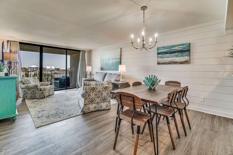 Dining area with Old River views and elegant lighting at Wind Drift 213 N Orange Beach