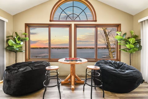 Upstairs game room with plenty of room to relax with family and friends and a lakefront view!