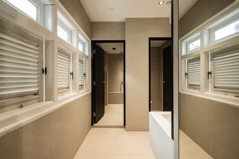 Shower, hair dryer, slippers, towels