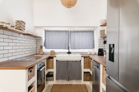 Villa | Private kitchen | Fridge, microwave, oven, stovetop