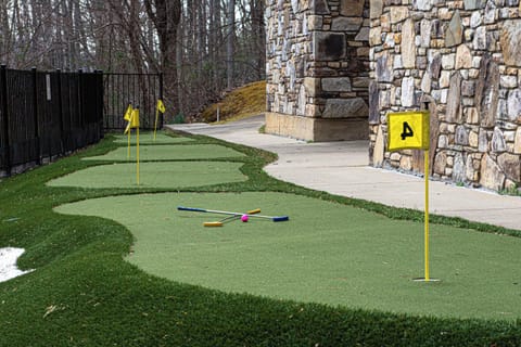 Enjoy your own private resort like amenities. 4-hole golf chipping and putting course. Whether you're honing in your golf game or enjoying friendly competition, this professional grade turf chip and putt course is yours to use all vacation long. 