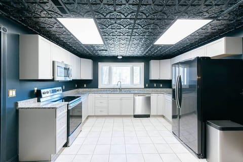 Need extra space for your holiday feast or family gathering? This 2nd kitchen in the basement offers the perfect setup for prepping, cooking, and serving large meals, giving your group the room to spread out, cook together, and make lasting memories.