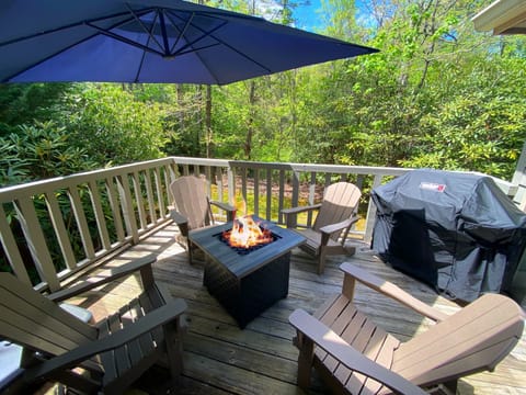 Enjoy time outdoors around the gas fire table in comfort while preparing dinner on the grill