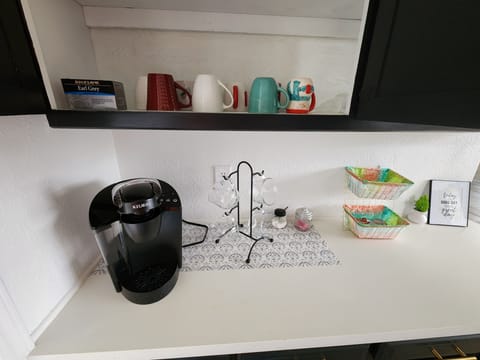 Keurig coffee maker and plenty of coffee cups!