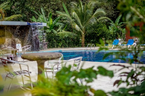Outdoor pool, open 8:00 AM to 10:00 PM, sun loungers