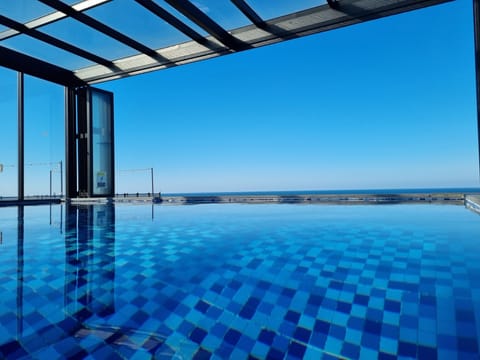 Indoor pool, seasonal outdoor pool, pool umbrellas, sun loungers
