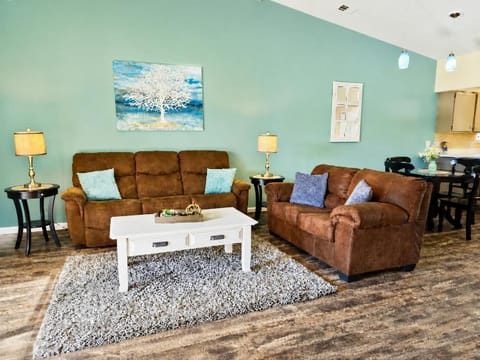 The 3-seat couch boasts two built-in recliners, perfect for lounging.