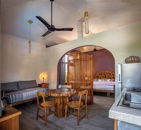 Deluxe Studio Suite | Living area | Flat-screen TV