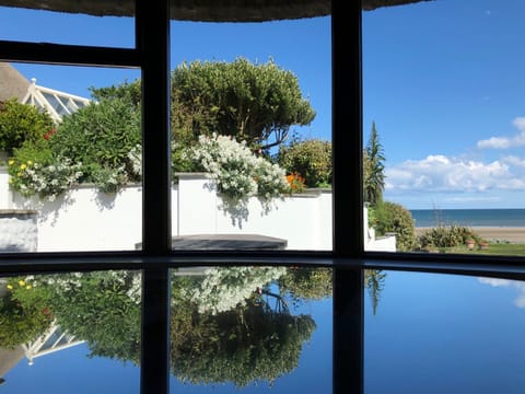Dreamy window seat with stunning sea and garden views.