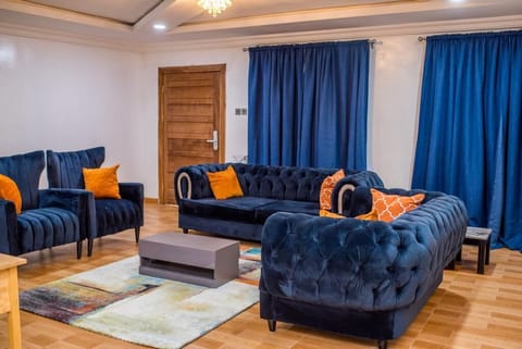 Business Triple Room | Living area | 32-inch Smart TV with digital channels, TV, computer monitors