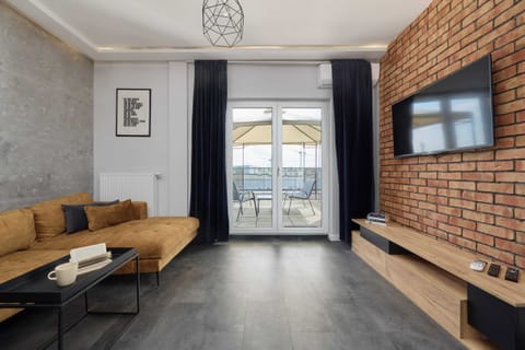 The living room's minimalist decor that enhances its elegant and modern feel.