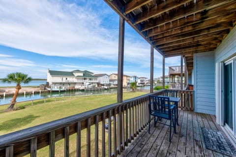 Covered deck with water views and comfortable seating for your morning coffee and peaceful moments.