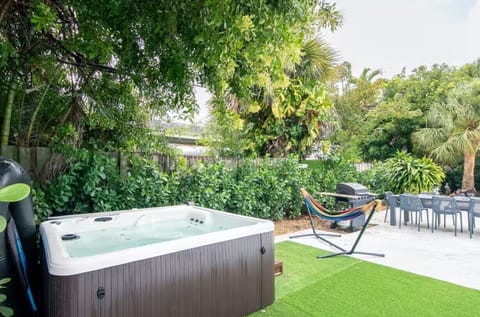 Private hot tub oasis—perfect to unwind after the beach.