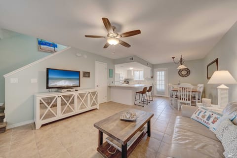 Living room with kitchen and dining area.