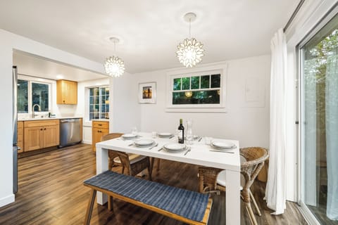 Dining room open to the living room. Sliding door to front deck.