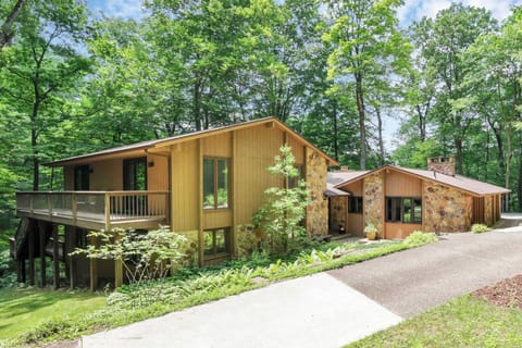 Front of the home surrounded by trees!