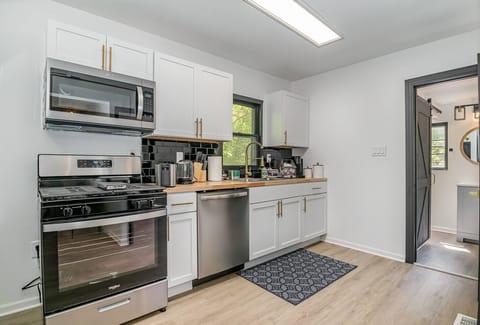 Kitchen Area with stainless steel Appliances | Microwave | | Cooking Range |