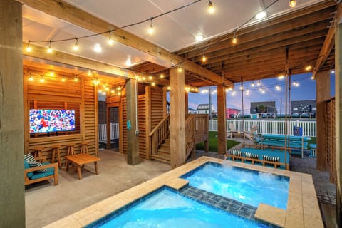 Heated pool & spa | Outdoor TV | Lounge seating | String lights | Daybed swing