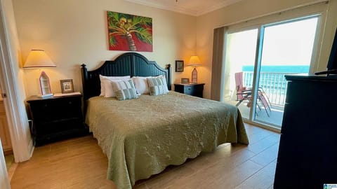 King size bed and adjacent full bath. Direct beachfront view &  balcony access.