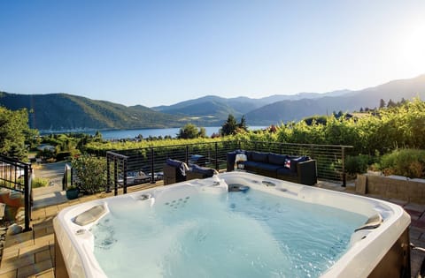 Please review listing description and Chelan County vacation rental rules - Summer views - hot tub and outdoor patio with dining table, BBQ and lounge seating