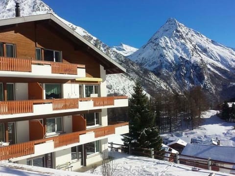 Sky, Snow, Property, Building, Window, Mountain, White, Slope, Tree, Cloud