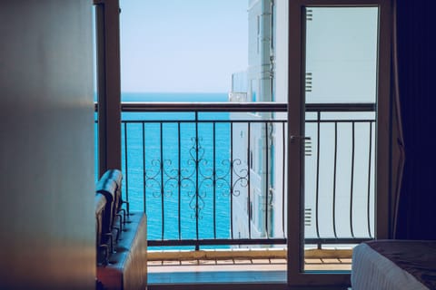 Family Room, 2 Queen Beds, Balcony, Partial Sea View | Living area | 43-inch flat-screen TV with digital channels, TV
