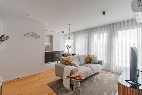 This inviting space features comfortable seating, stylish decor, and ample natural light. #modern #airbnbporto
